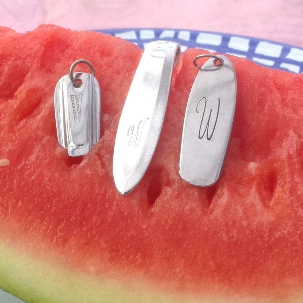 "W" monogrammed pendant made from silverware
